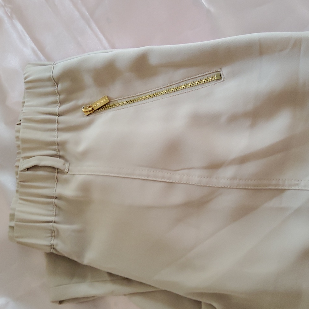 Elegant Cream Calvin Klein Women's Silk Pants.